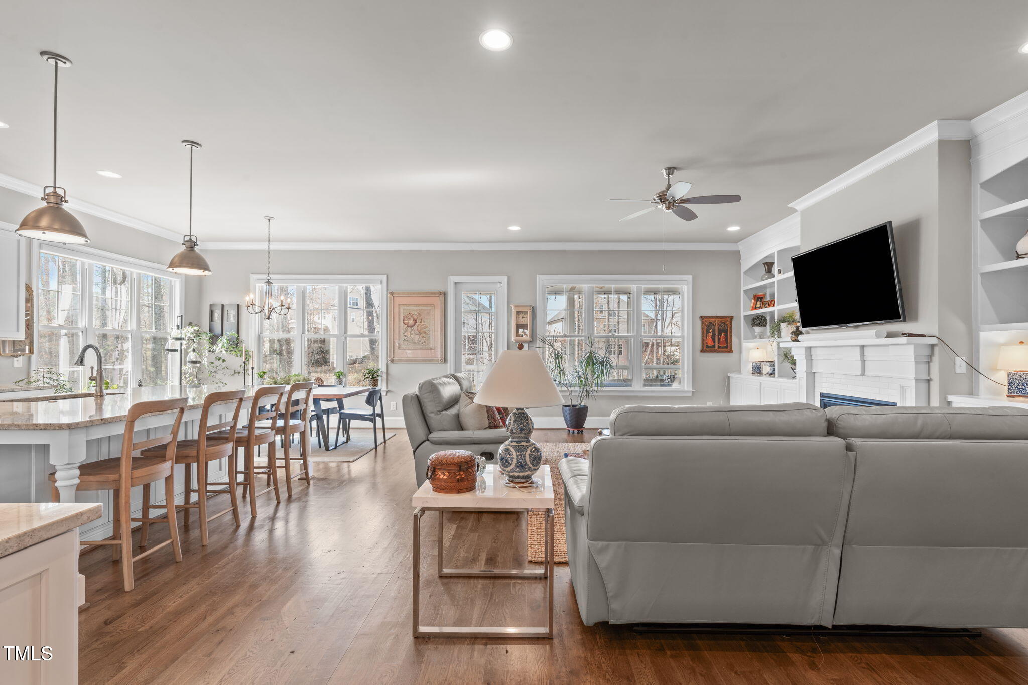2826 Walden Road Apex, NC 27502 - Photo 11 of 50 a living room with furniture and a flat screen tv