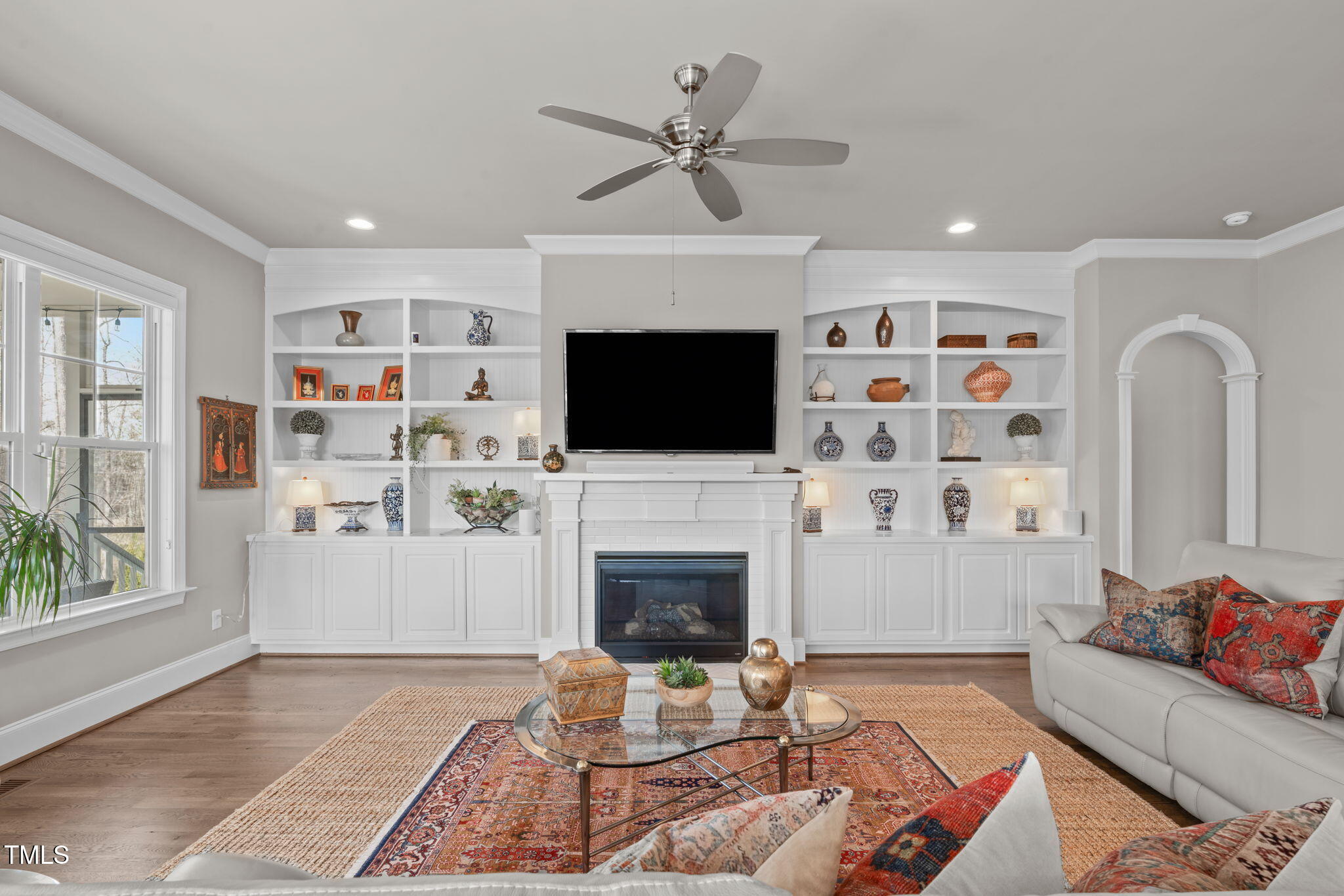 2826 Walden Road Apex, NC 27502 - Photo 16 of 50 a living room with fireplace furniture and a flat screen tv