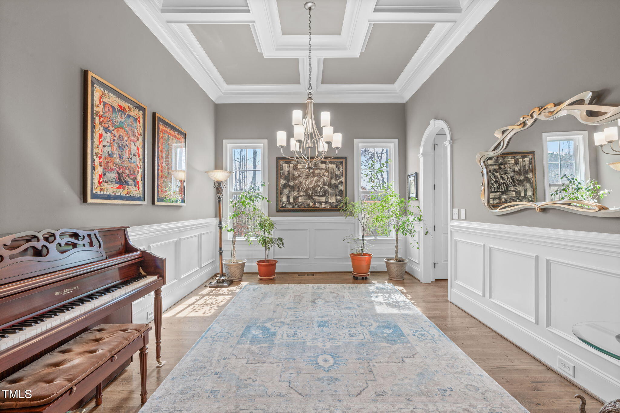 2826 Walden Road Apex, NC 27502 - Photo 18 of 50 a hall way with furniture a chandelier and a window