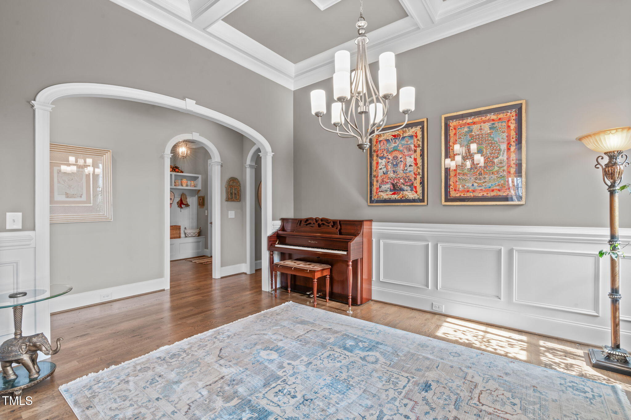 2826 Walden Road Apex, NC 27502 - Photo 19 of 50 a living room with furniture and a chandelier
