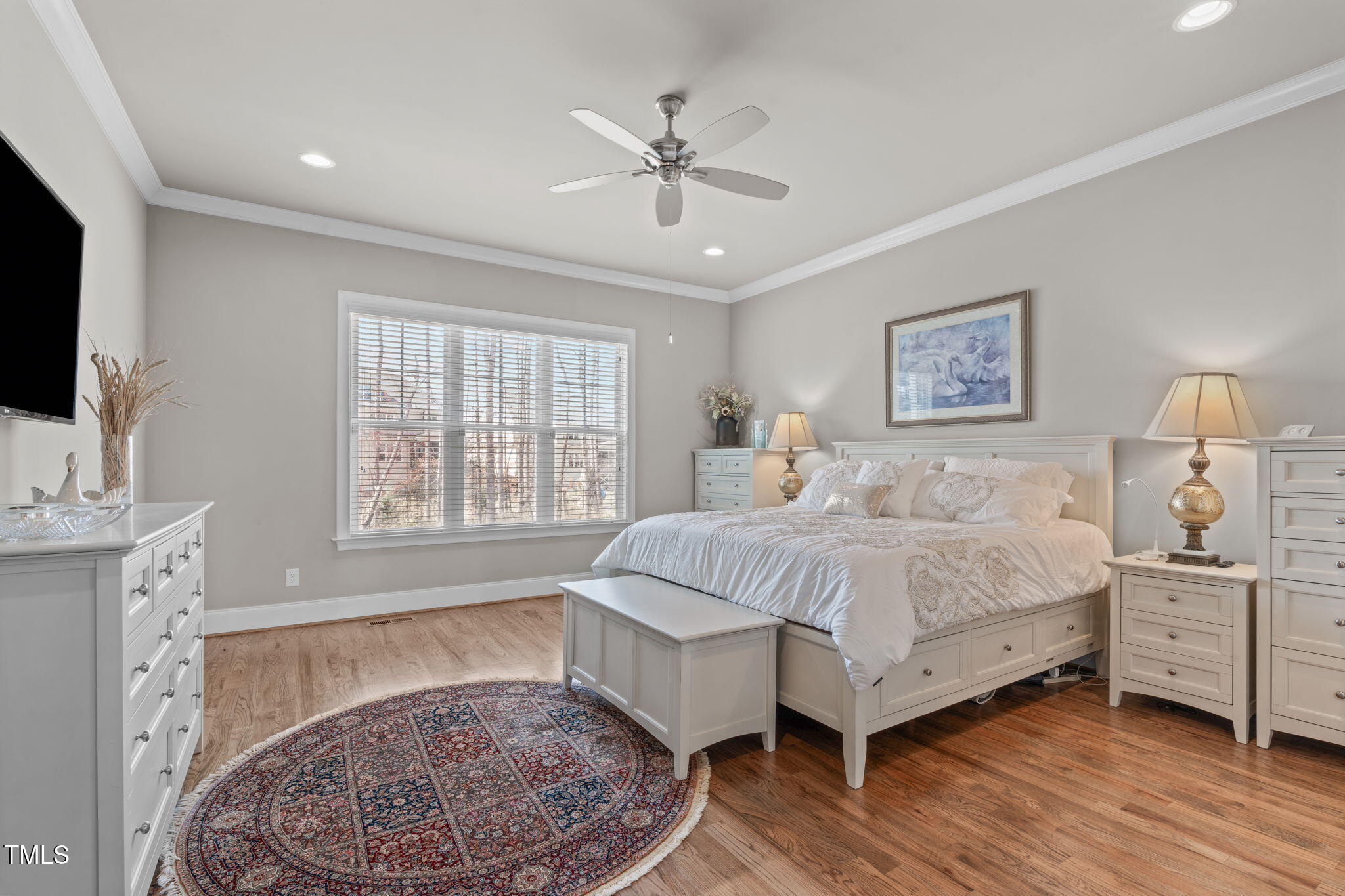 2826 Walden Road Apex, NC 27502 - Photo 20 of 50 a spacious bedroom with a large bed and a chandelier