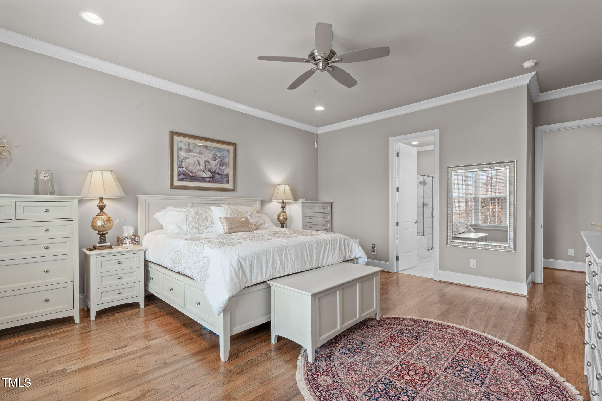 2826 Walden Road Apex, NC 27502 - Photo 21 of 50 a spacious bedroom with a bed and a chandelier