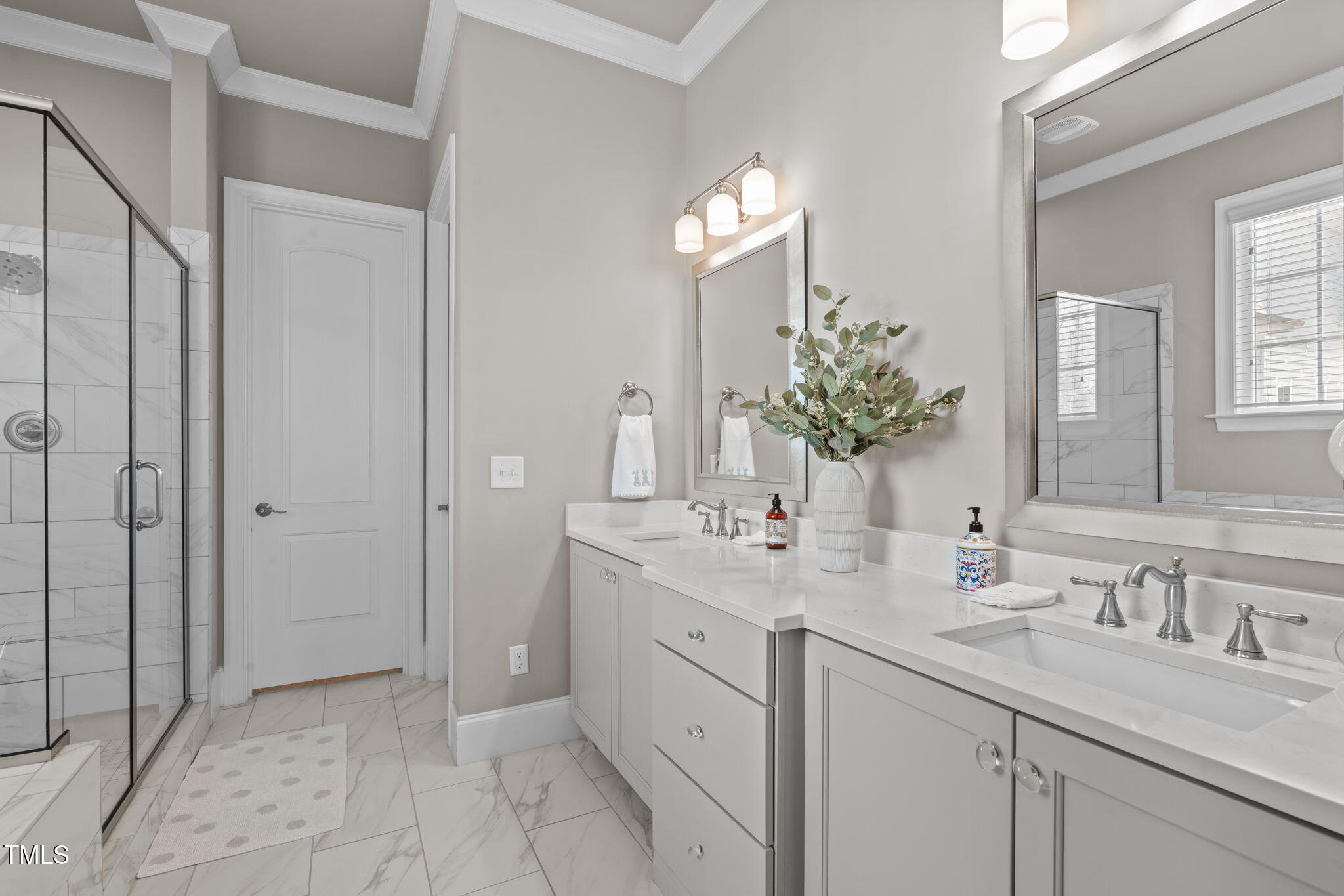 2826 Walden Road Apex, NC 27502 - Photo 24 of 50 a bathroom with a double vanity sink and a mirror