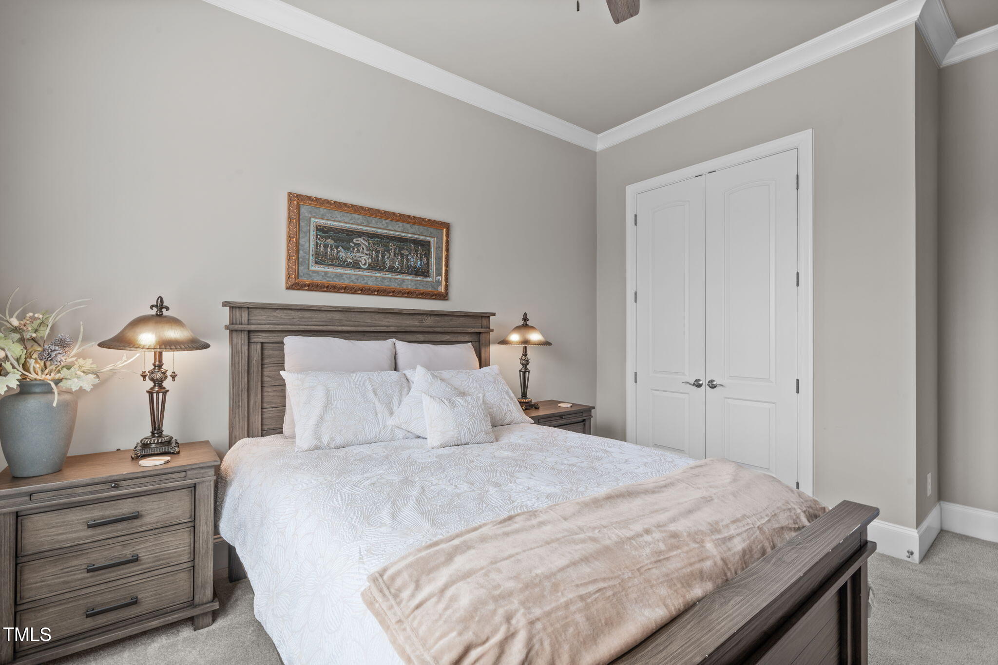 2826 Walden Road Apex, NC 27502 - Photo 32 of 50 a bedroom with a bed and a lamp on table