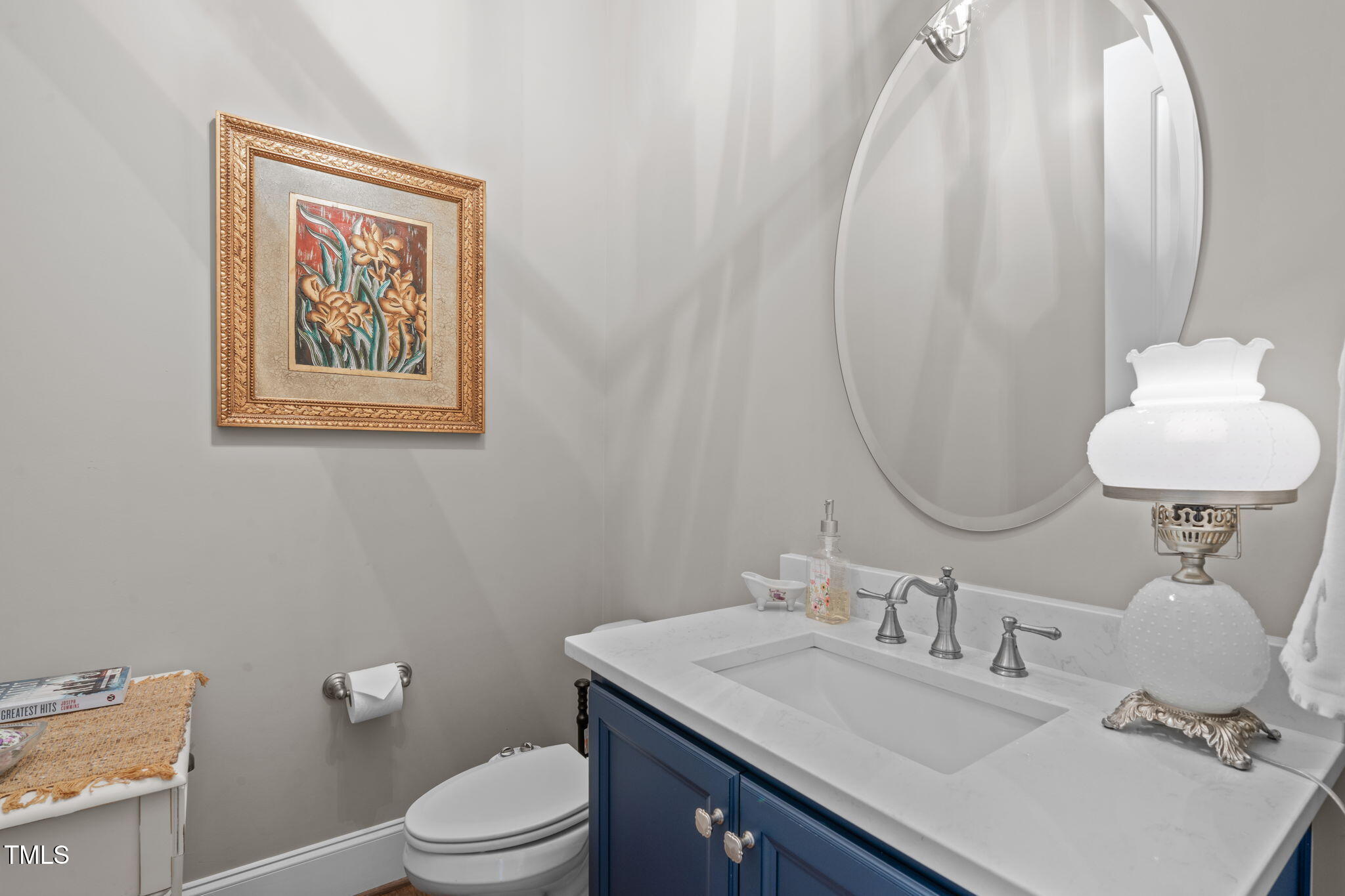 2826 Walden Road Apex, NC 27502 - Photo 33 of 50 a bathroom with a sink mirror and toilet