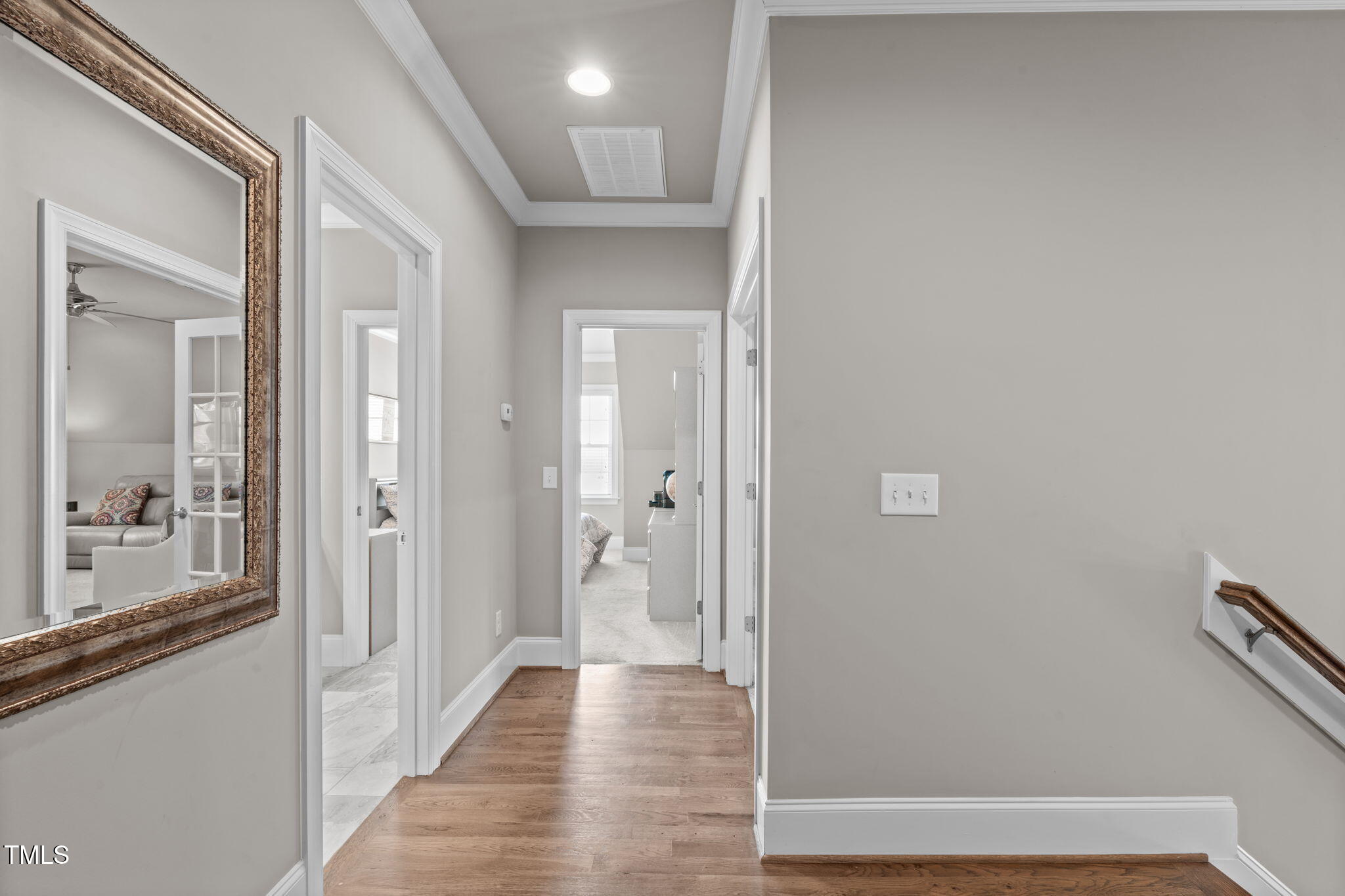 2826 Walden Road Apex, NC 27502 - Photo 35 of 50 a view of a hallway with wooden floor