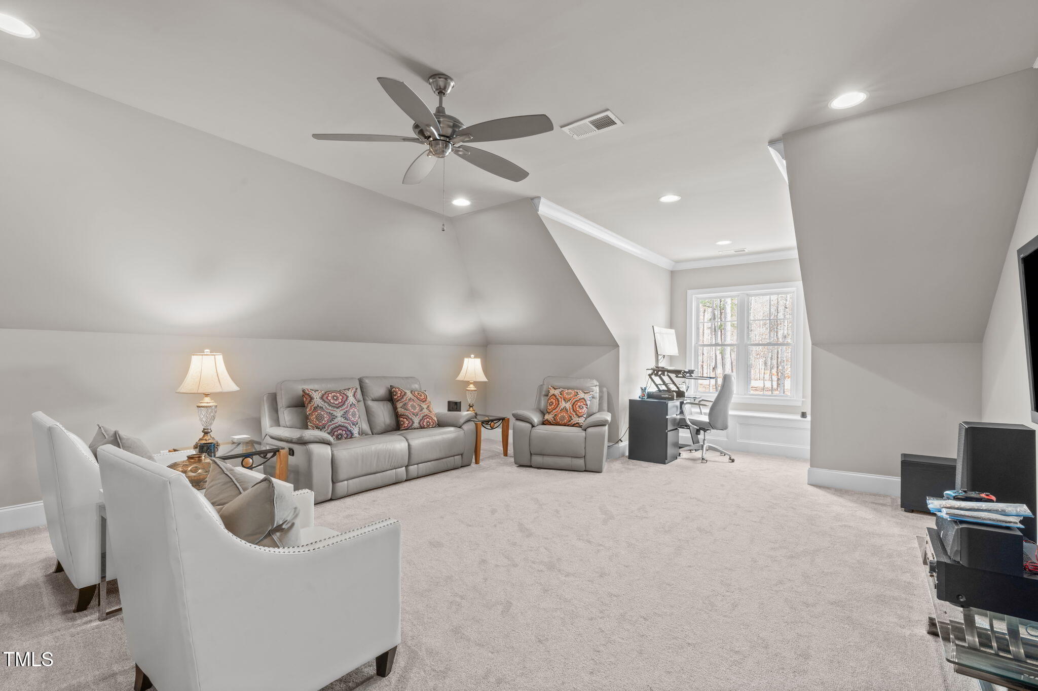 2826 Walden Road Apex, NC 27502 - Photo 39 of 50 a living room with furniture and a chandelier