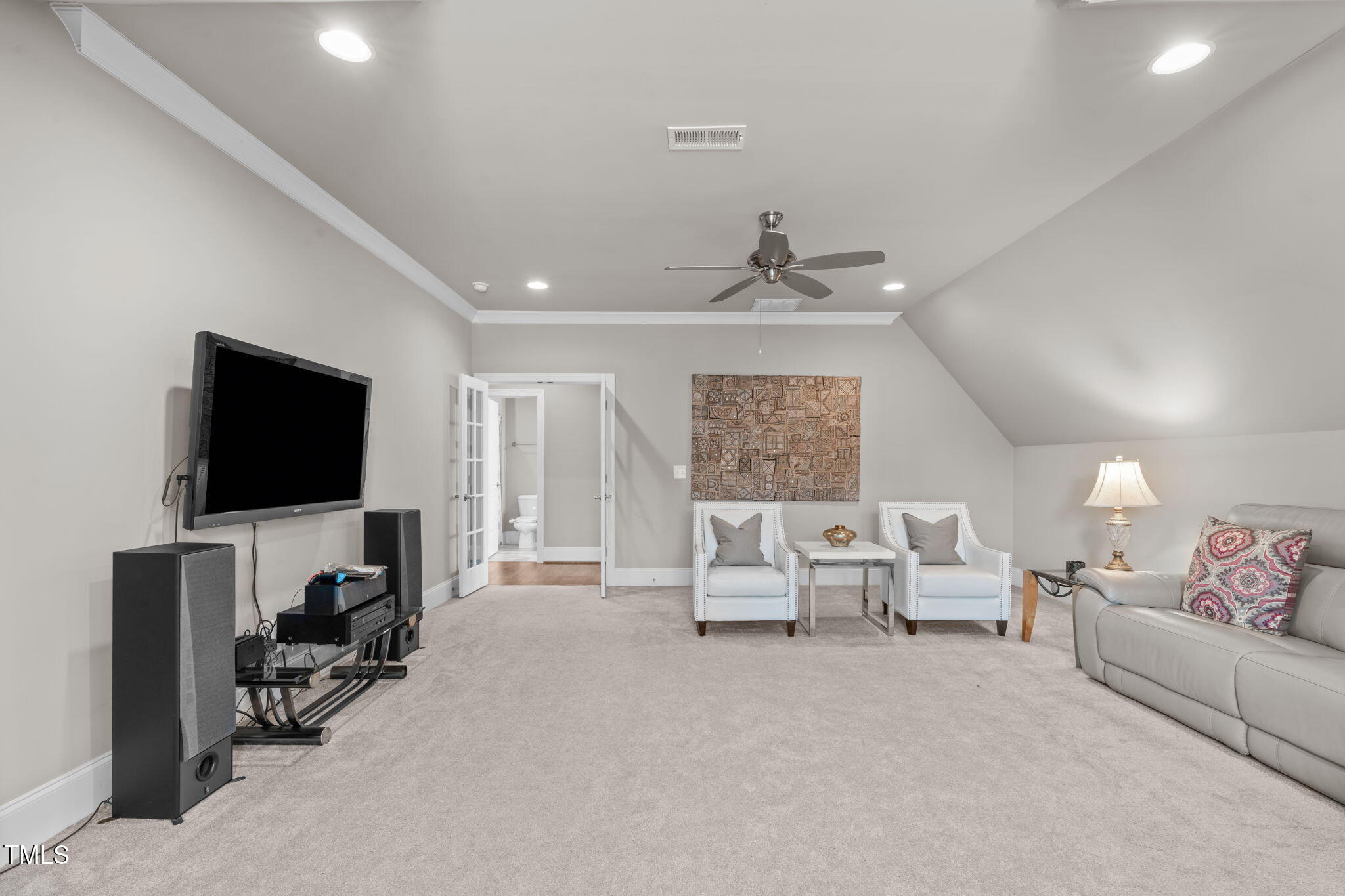 2826 Walden Road Apex, NC 27502 - Photo 40 of 50 a living room with furniture and a flat screen tv