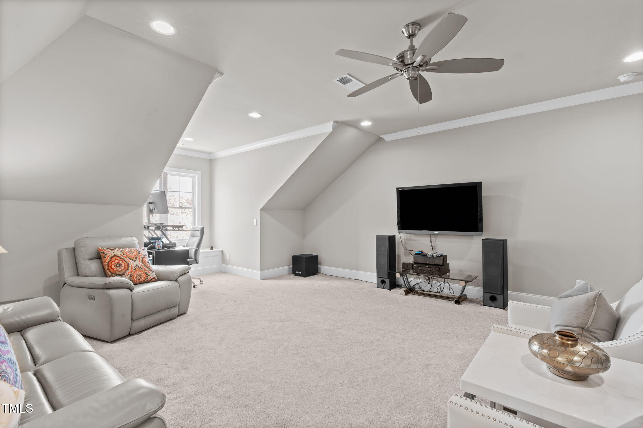 2826 Walden Road Apex, NC 27502 - Photo 41 of 50 a living room with furniture and a flat screen tv