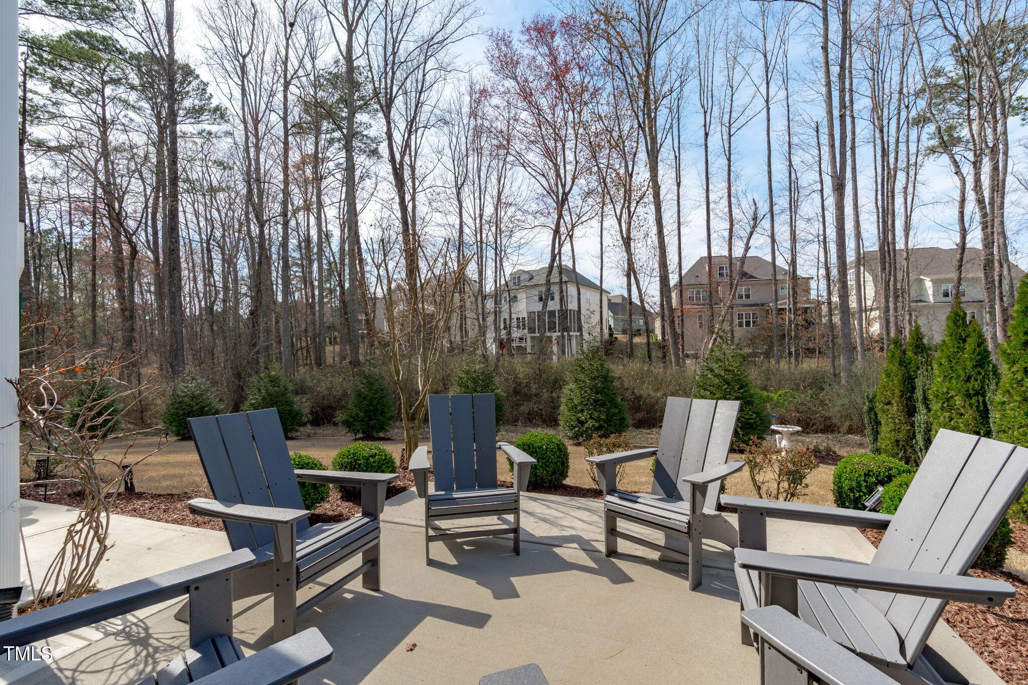 2826 Walden Road Apex, NC 27502 - Photo 44 of 50 a view of a patio with a table and chairs