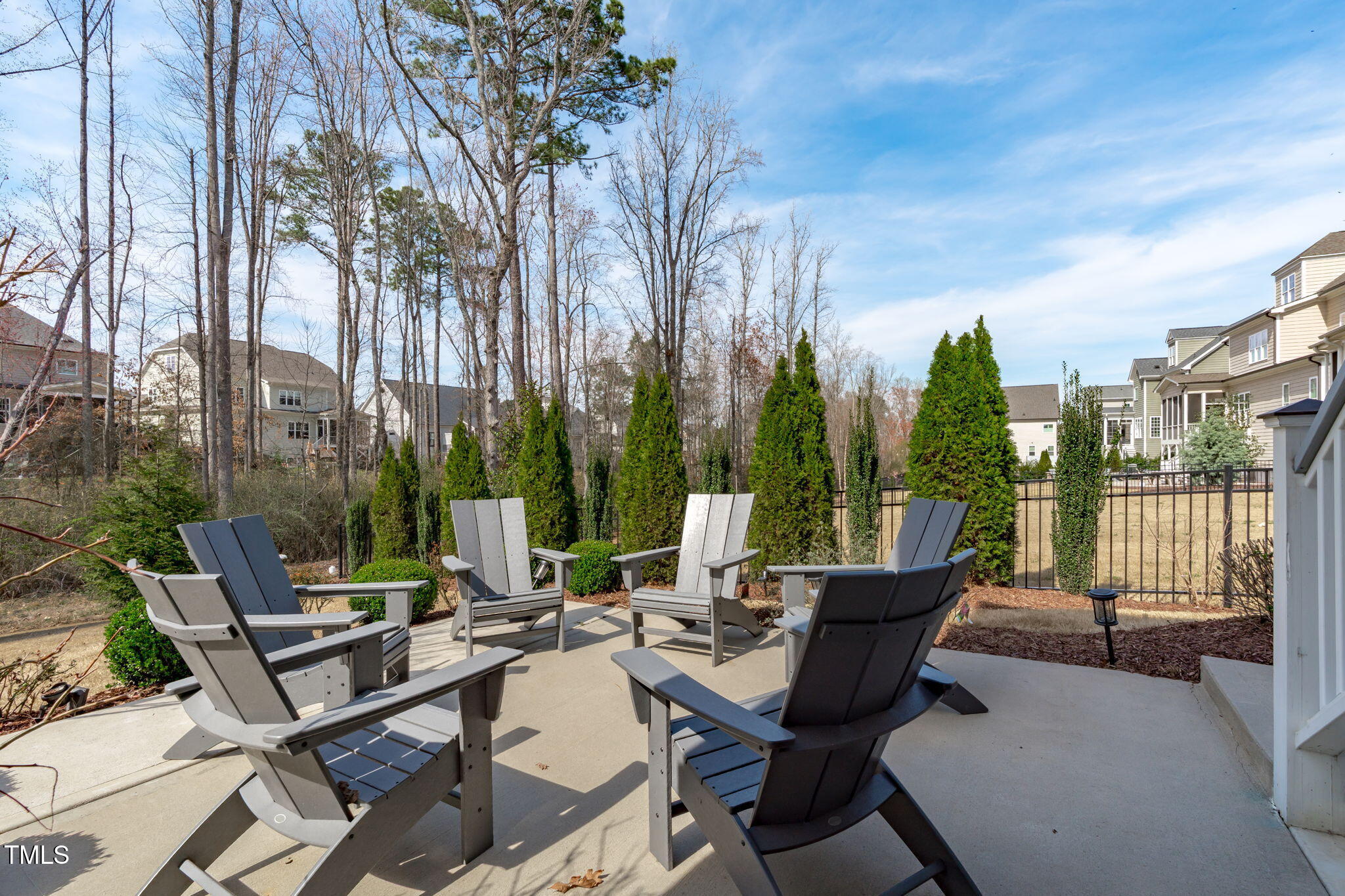 2826 Walden Road Apex, NC 27502 - Photo 45 of 50 a view of a patio with a table chairs and a fire pit