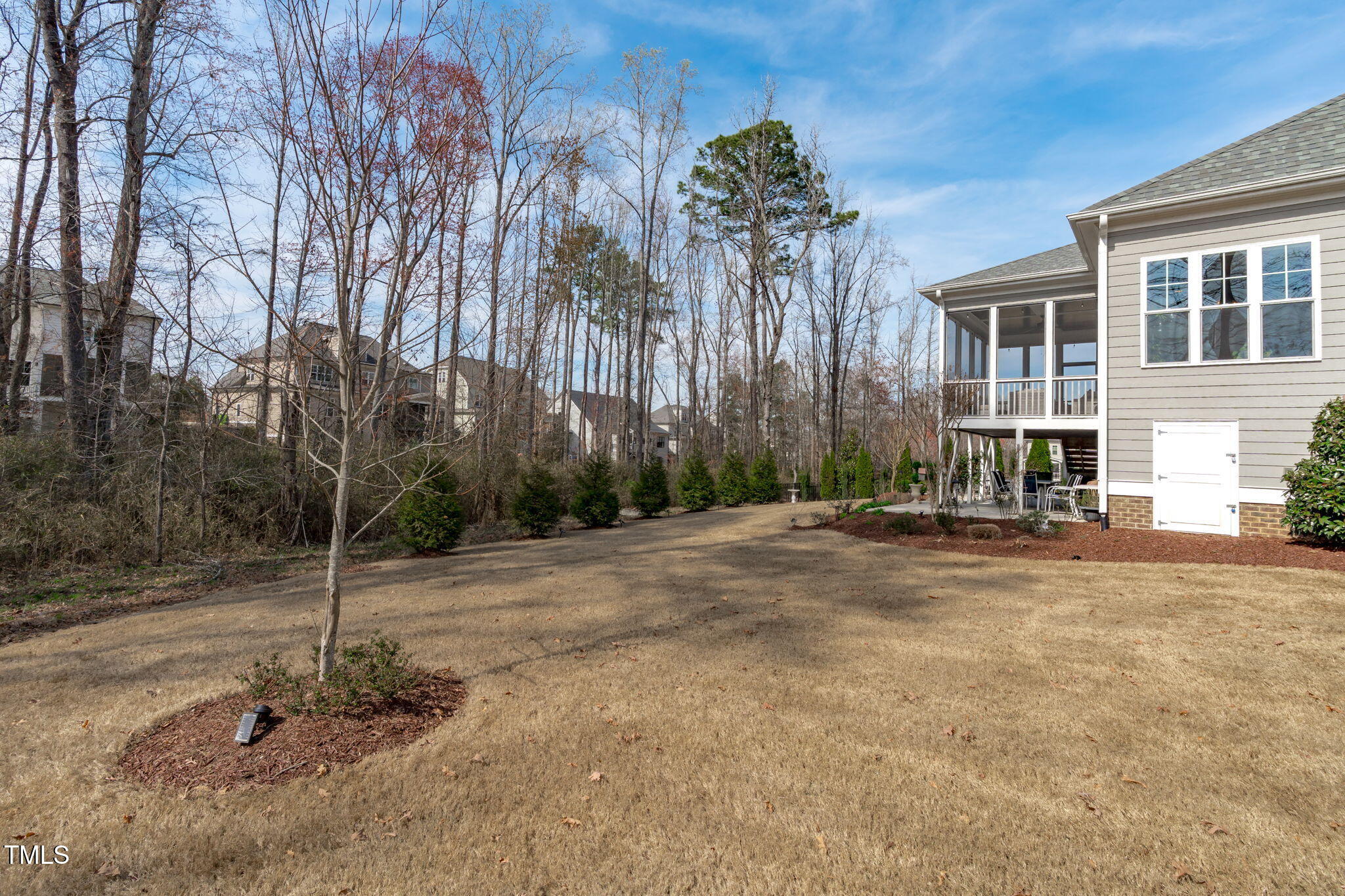 2826 Walden Road Apex, NC 27502 - Photo 46 of 50 a backyard of a house with table and chairs
