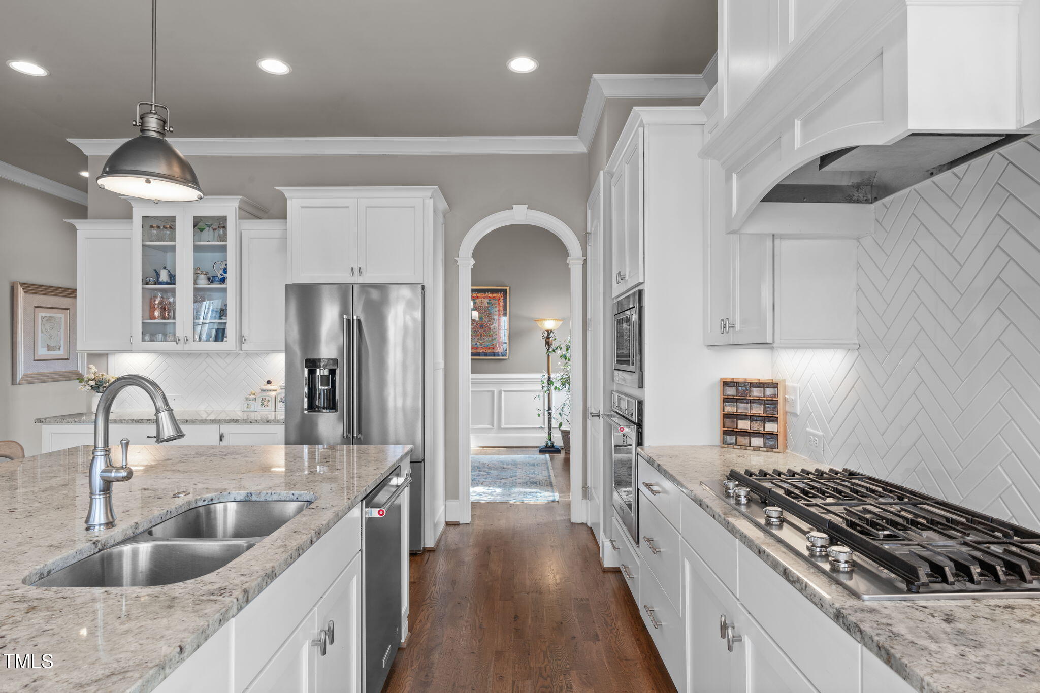 2826 Walden Road Apex, NC 27502 - Photo 7 of 50 a kitchen with stainless steel appliances granite countertop a sink stove and refrigerator