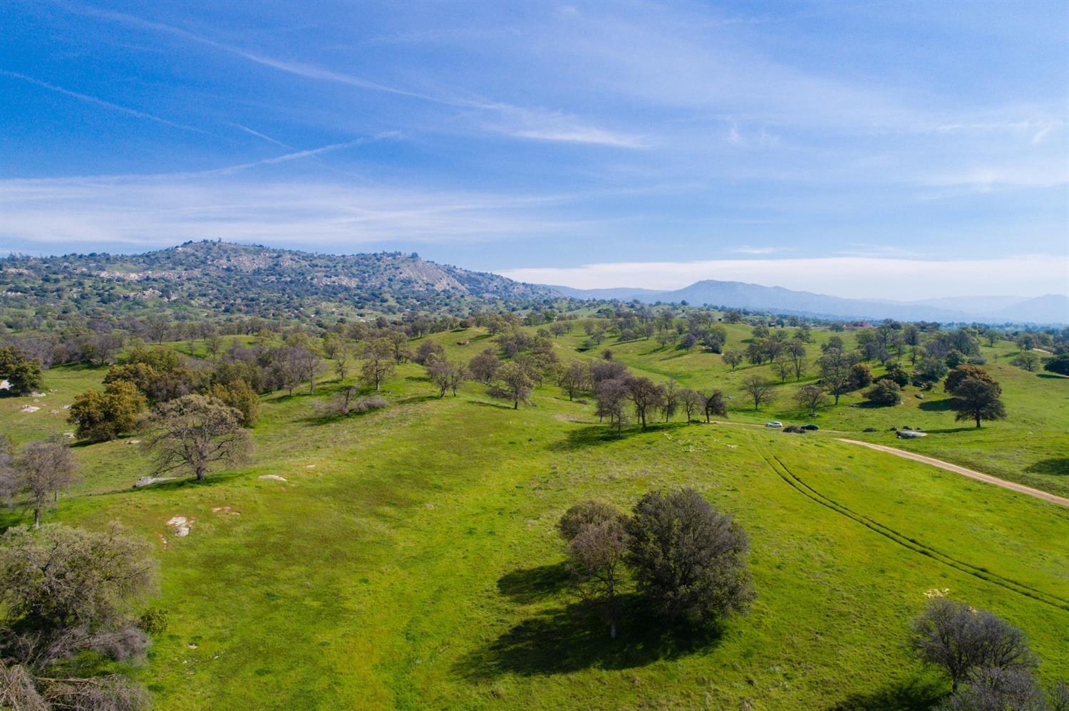 11999 Millerton Road Clovis, CA 93619 - Photo 2 of 19 a view of a lake with a mountain