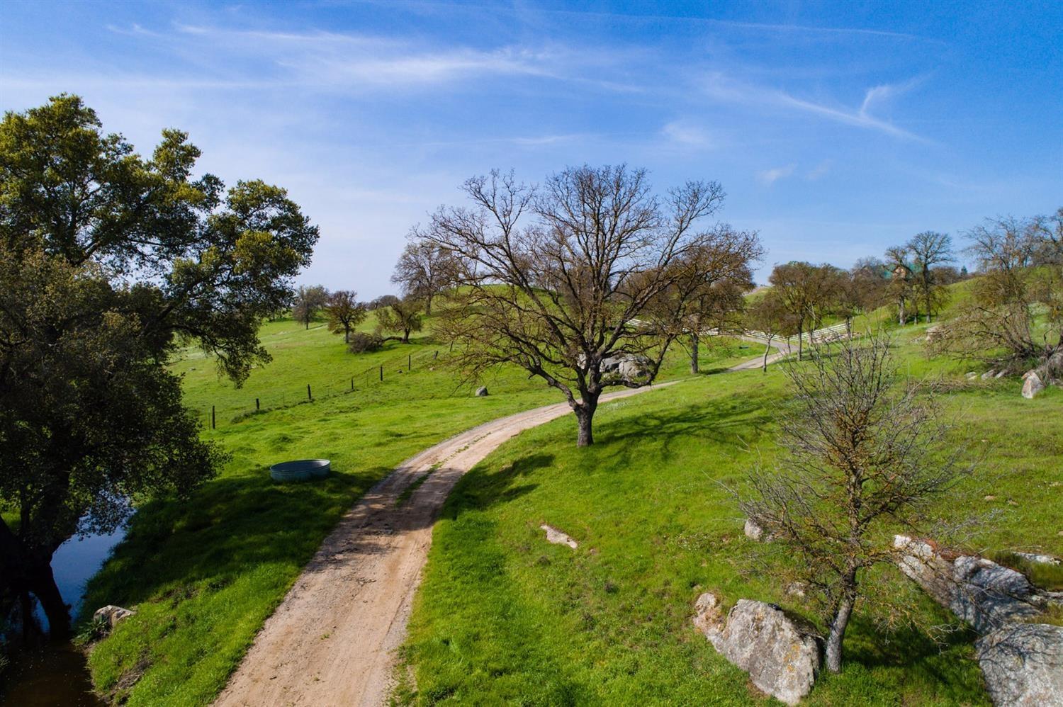 11999 Millerton Road Clovis, CA 93619 - Photo 6 of 19 a view of a lake with a yard