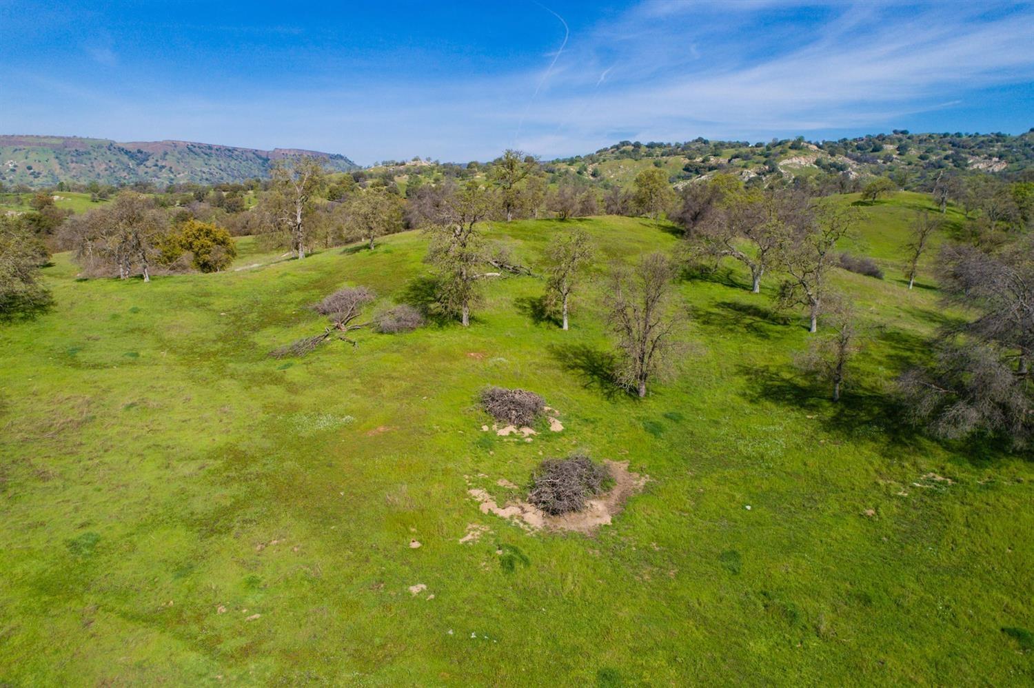11999 Millerton Road Clovis, CA 93619 - Photo 7 of 19 a view of a lake with a mountain in the background