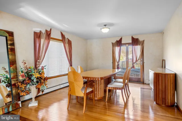a kitchen with stainless steel appliances kitchen island granite countertop a refrigerator and a sink