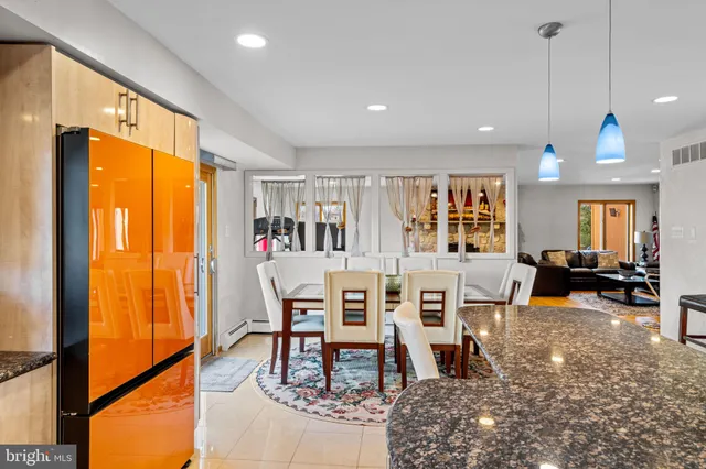 a view of a dining room with furniture window and outside view