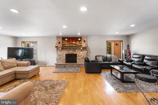 a living room with furniture and a kitchen