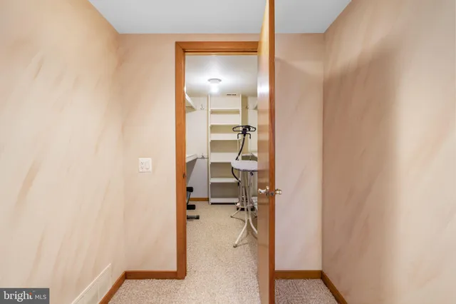 a white toilet sitting next to a bathroom sink