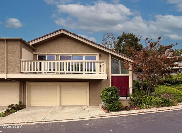 a house with trees in the background