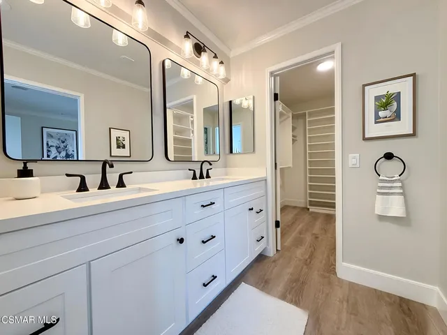 a bathroom with a double vanity sink mirror and double