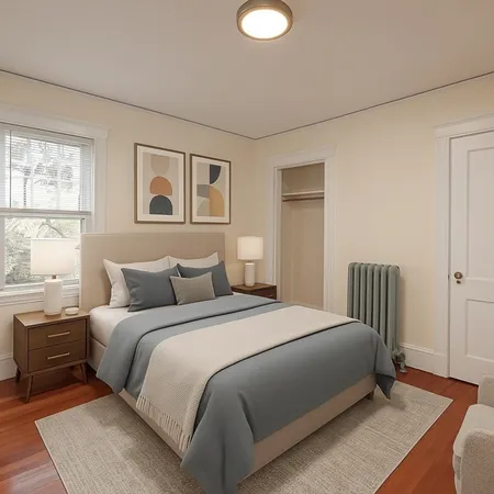 a bedroom with a large bed and a window