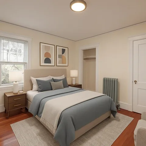 a bedroom with a large bed and a window