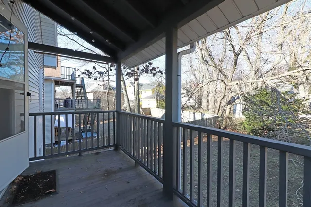 a view of a porch with wooden floor and outdoor space
