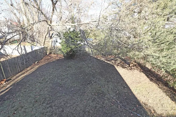 a view of a backyard of the house