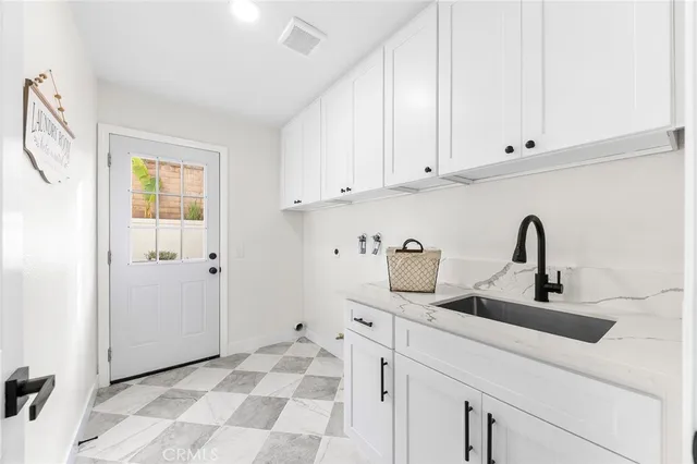 a kitchen with a sink and cabinets