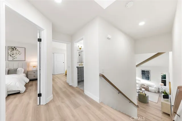 a bedroom with furniture and a wooden floor