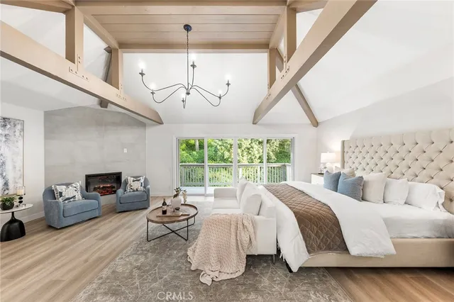 a living room with furniture ceiling fan and a fireplace