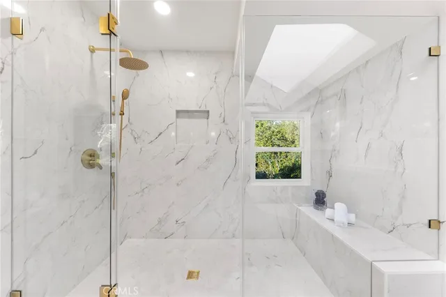 a bathroom with a bathtub and shower