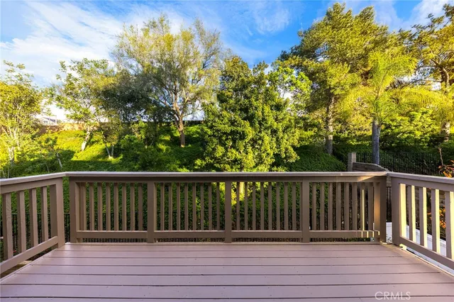 a bedroom with a bed and a potted plant