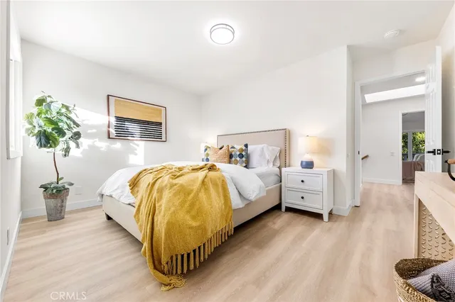 a view of a house with a large window and balcony