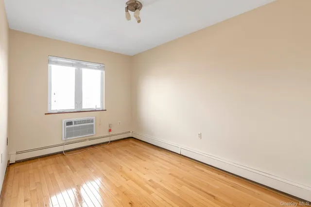 an empty room with a empty space and window