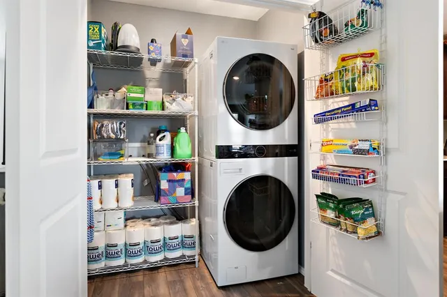 a living room with a wooden floor and a fireplace