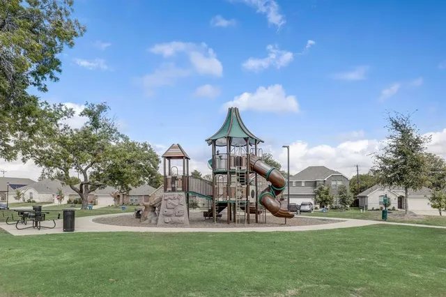 a view of a park with large trees