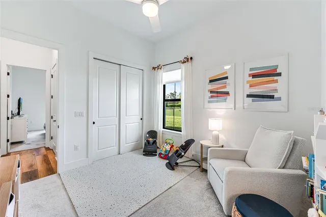 a children room with furniture and a window
