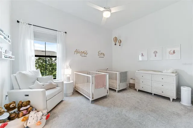 a spacious bathroom with a double vanity sink and a mirror