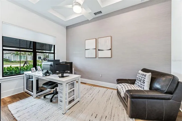 a work room with furniture and windows