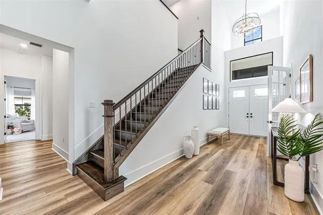 a view of entryway and hall with wooden floor