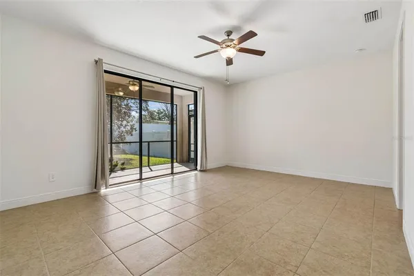 a view of an empty room with a window