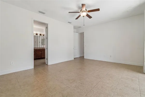 a kitchen with stainless steel appliances granite countertop a stove refrigerator a sink and microwave