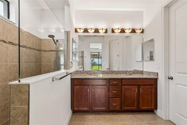 a kitchen with stainless steel appliances granite countertop wooden cabinets a sink and dishwasher