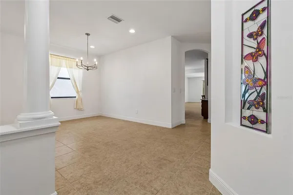 a spacious bedroom with a large bed and a window
