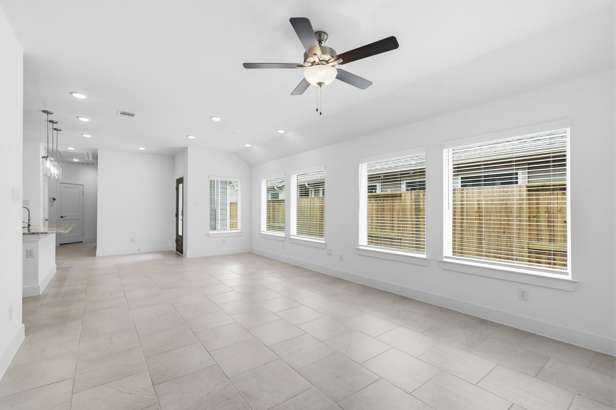 5251 Celestial Court Rosharon, TX 77583 - Photo 21 of 46 a view of an empty room with a window and a kitchen