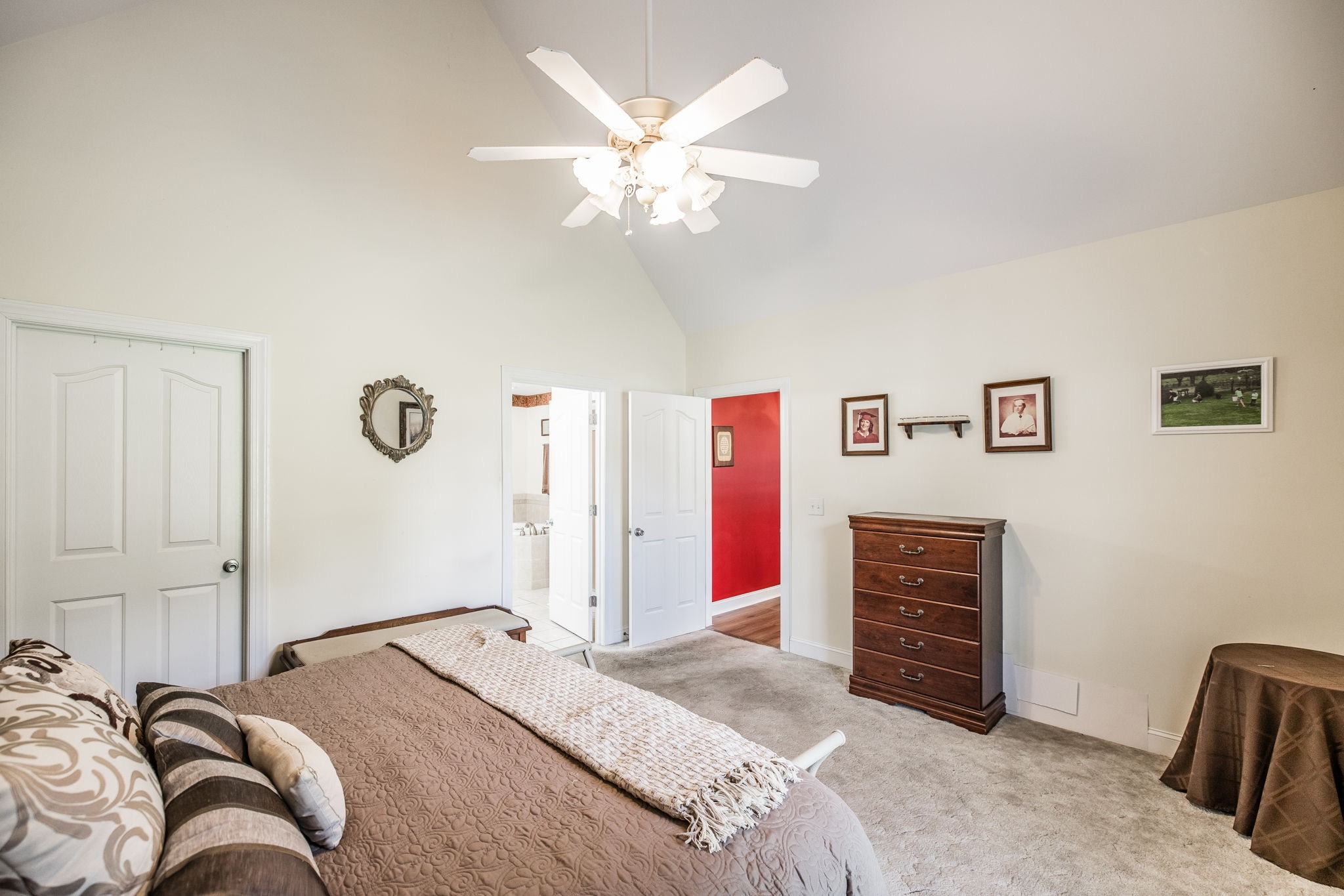 310 Rock Bridge Road Gallatin, TN 37066 - Photo 28 of 43 a bedroom with a large bed and a chandelier