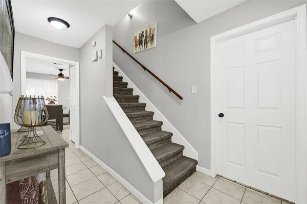 a view of entryway and hall with wooden floor